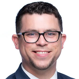 Smiling man, wearing glasses